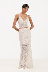 Front view of cream lace maxi skirt with inner lining, paired with a matching lace bra top