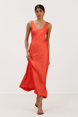 Front view of bright coral satin slip dress