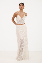 Front view of cream lace bra top paired with matching lace maxi skirt