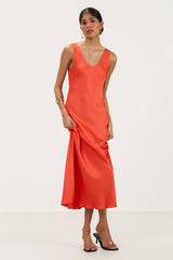 Front view of bright coral satin slip dress